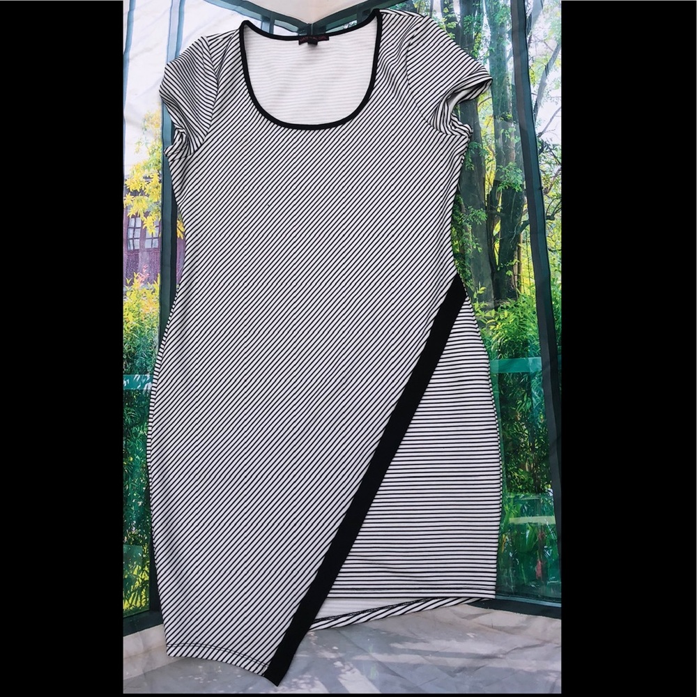 Curve hugging, striped dress w/asymmetrical bottom